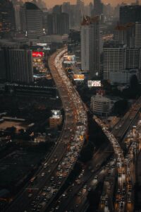 Busy city highways with heavy traffic at dusk.